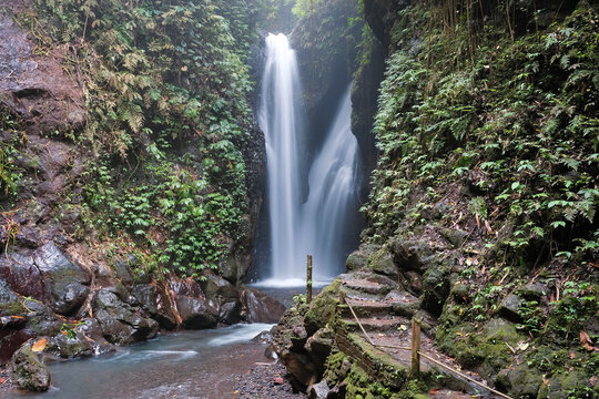 View of Git Git waterfall on cloudy day. Gitgit, Bali, Indonesia.