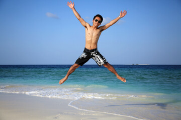 Fototapeta premium Jumping into the paradise in Maldives
