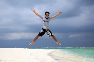 Jumping into the paradise in Maldives