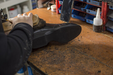 Shoemaker performs shoes in the studio craft