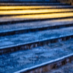 Annecy, France - September 11 2020 : concrete stone steps on a pedestrian sidewalk at night with several steps illuminated