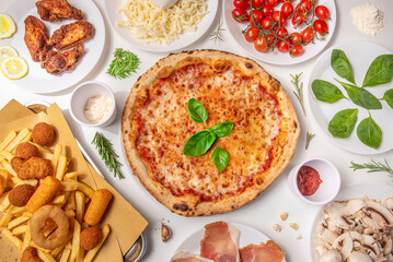 Italian restaurant and pizzeria food composition seen from above with ingredients on a white...