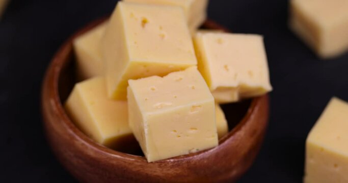 yellow semi-hard cheese with holes, fresh cheese from milk