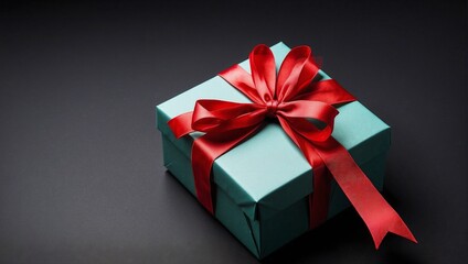 Obraz premium Colorful Gift Box Tied with Red Ribbon, Black Background, Studio Shot, Top View