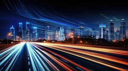 Fototapeten Light flow of traffic on a nighttime highway in a city with modern high buildings © GulArt
