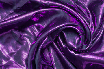 Twisted smooth elegant silk or satin fabric in dark purple color