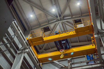 Unit overhead crane on the power plant project for maintenance purpose. The photo is suitable to use for industry background photography, power plant poster and maintenance content media.