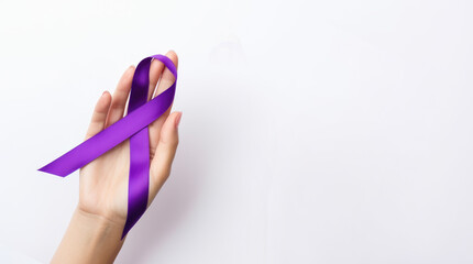 Purple ribbon in hand for World cancer day, Violence awareness  day