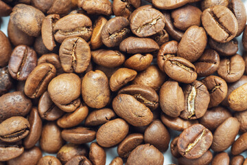 Close-up of roasted coffee beans. Can be used as a food background. Macro, top view, flat lay