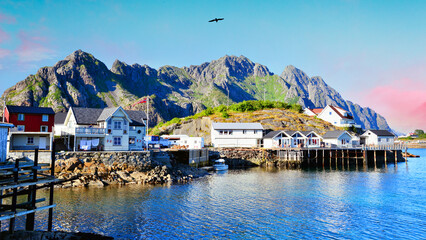 Beautiful sunrise over Hamnoy, fishermen village with the typical red houses of the Lofoten...