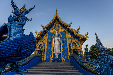 Background Chiang Rai Blue Temple or Wat Rong Seua Ten is located in Rong Suea Ten in the district of Rimkok a few kilometers outside Chiang Rai,Thailand - obrazy, fototapety, plakaty