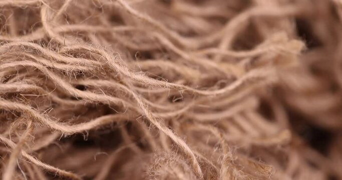 rough linen rope close-up, rough rope on a wooden table