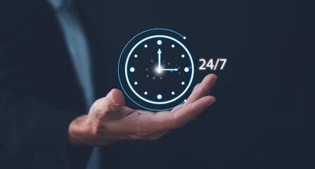 Nonstop service concept. Businessman show virtual 24-7 with clock for worldwide nonstop and full-time available contact of customer service concept. Full-time available contact of service concept.