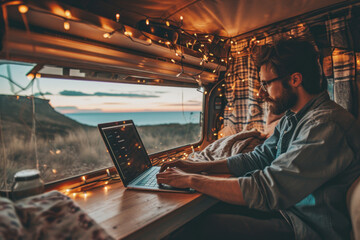 a man handsome using laptop in the camper car in the holiday - obrazy, fototapety, plakaty