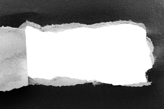 Black paper background with copy space. Hole on a crumpled dark sheet