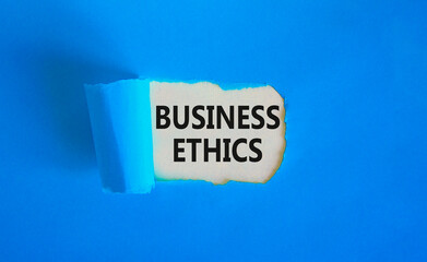 Business ethics symbol. Concept words Business ethics on beautiful white paper. Beautiful blue...