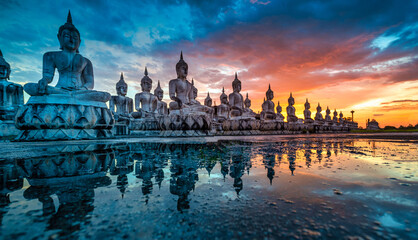 Many Statue buddha image at sunset in southen of Thailand - obrazy, fototapety, plakaty