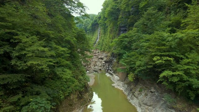 Cinematic aerial shot of steam vents at Oyasukyo Gorge in Akita prefecture in Japan
