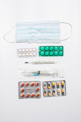 Many different blisters with tablets, medicine, treatment tablets, syringes