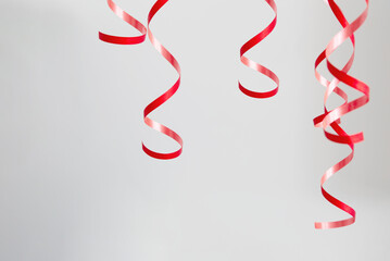 red serpentine tape on background gray wall