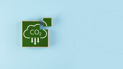 Concept of reducing carbon dioxide emissions into the world's atmosphere, carbon dioxide symbol on wooden block, global warming, sustainable development and green business from renewable energy