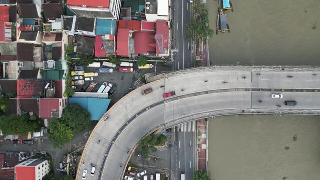 Car traffic on Makati - Mandaluyong bridge in Metro Manila, Philippines. Aerial top view.