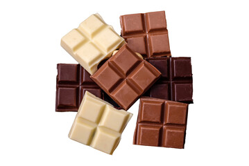 A mix of several types of delicious sweet chocolate broken into cubes on a black plate