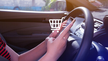 Shopping Online. Using Smartphone shopping online in car. shopping cart and business icons with...