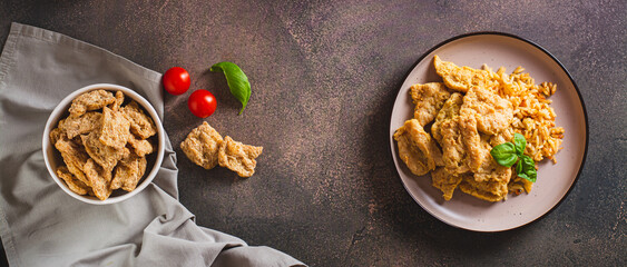 Alternative soy meat with rice on a plate on the table top view web banner
