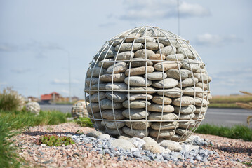 Decorations in the garden in the form of a pebble ball