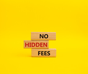 No Hidden Fees symbol. Concept words No Hidden Fees on wooden blocks. Beautiful yellow background. Business and No Hidden Fees concept. Copy space.