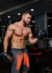 Fototapeta na wymiar Strong muscles shirtless man training. Workout athletic bodybuilder.
