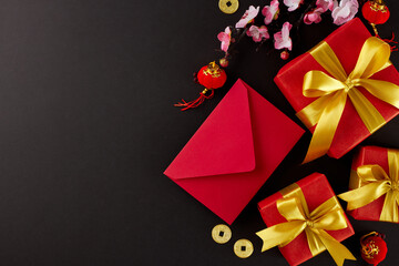 Exchanging gifts during Chinese New Year. Top view flat lay of red envelope, present boxes, chinese...