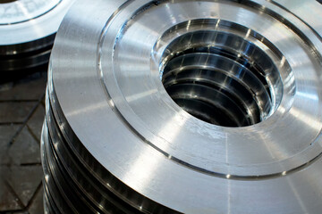 Close-up of Large steel pipes at a machine-building plant.