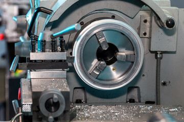 Close-up of a CNC lathe machine. Manufacturing of steel parts for heavy industry.