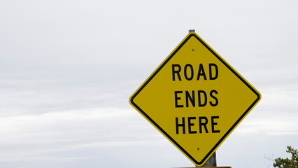 Humorous sign about a dead end road.