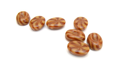 Caramel candies isolated on white background
