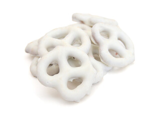 White chocolate covered pretzels on white background  - 697822718