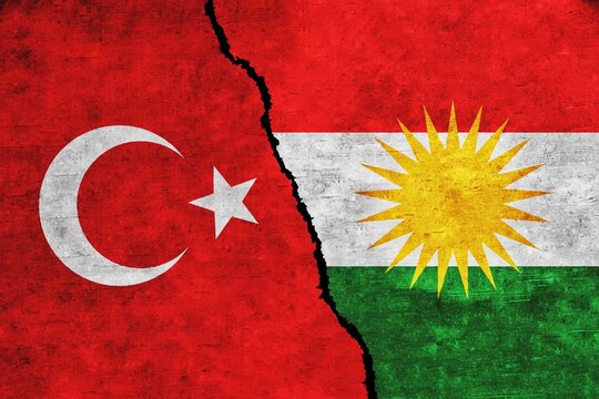 Turkey and PKK flags on wall with a crack. Kurdistan and Turkey conflict, war crisis, economy, relationship, trade concept