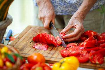 Woman Hands Preparing Fresh Tomatoes From Domestic Garden into Tomato Sauce