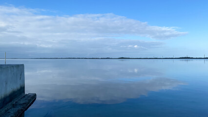 Blue Silver Gray Sky and Cloud Reflections in Water in Florida Keys
