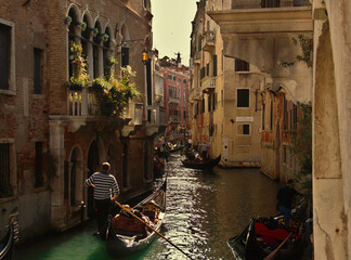 Gondolas passage canal in Venice