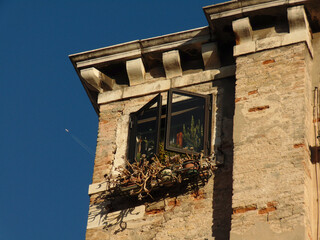 Detail of the windows of an old house in the city of Venice, Italy