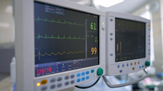Pulse and heart rate of a patient during the surgery. Close up look at the monitors of lung ventilating machine.