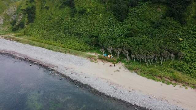 Aerial view at coastline and camp, island Kunashir