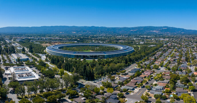 Aerial view of the main Apple office building - a space ship in California, USA. - Powered by Adobe