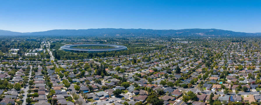 Aerial view of the main Apple office building - a space ship in California, USA. - Powered by Adobe