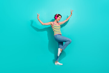 Fototapeta na wymiar Full length photo of positive nice person chilling dancing listen favorite playlist isolated on teal color background