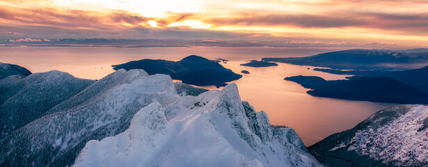 Snow Covered Mountains on Pacific Ocean Coast. Aerial Canadian Winter Landscape - obrazy, fototapety, plakaty