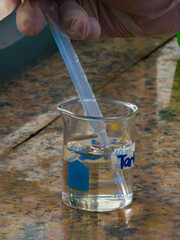Pipetting a Chemical in a Beaker